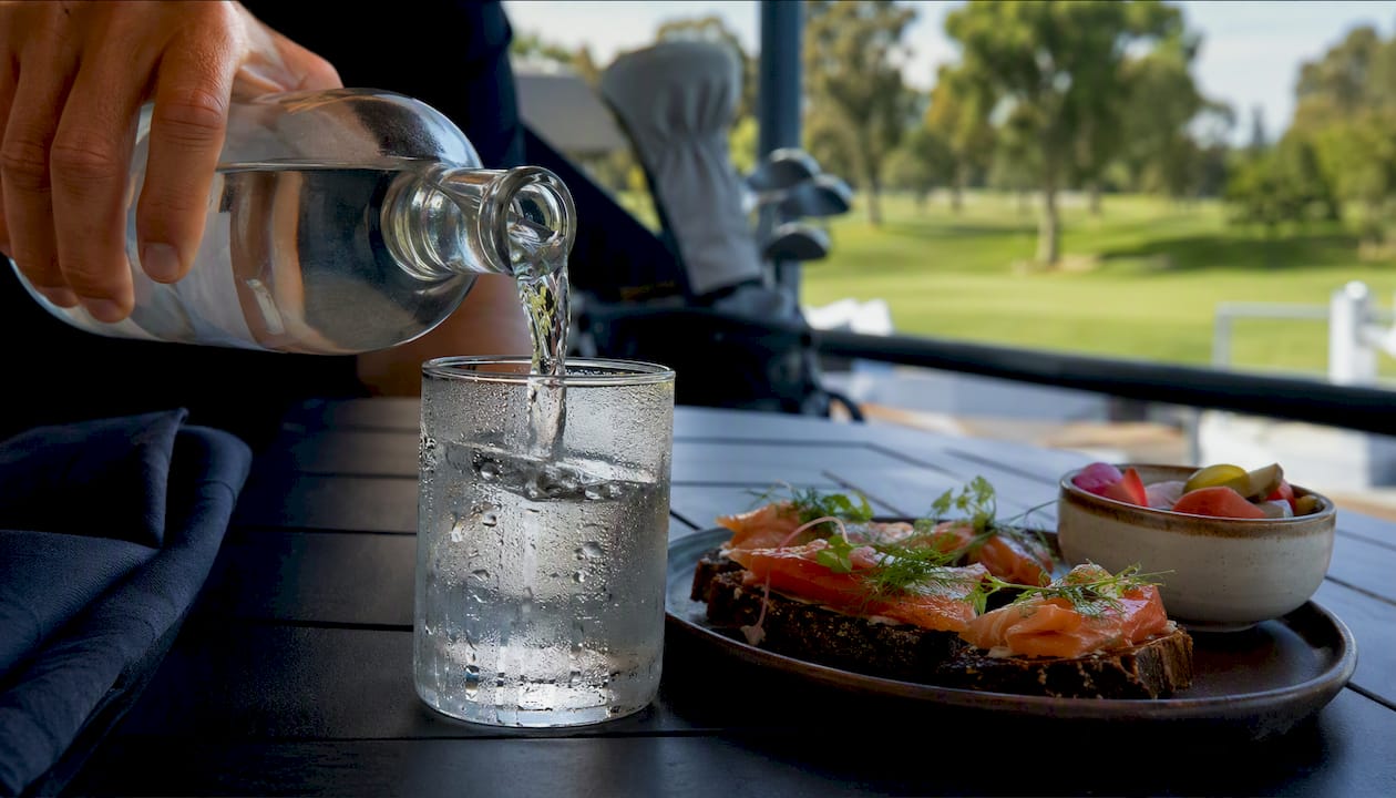 Pouring vodka with gourmet food bites