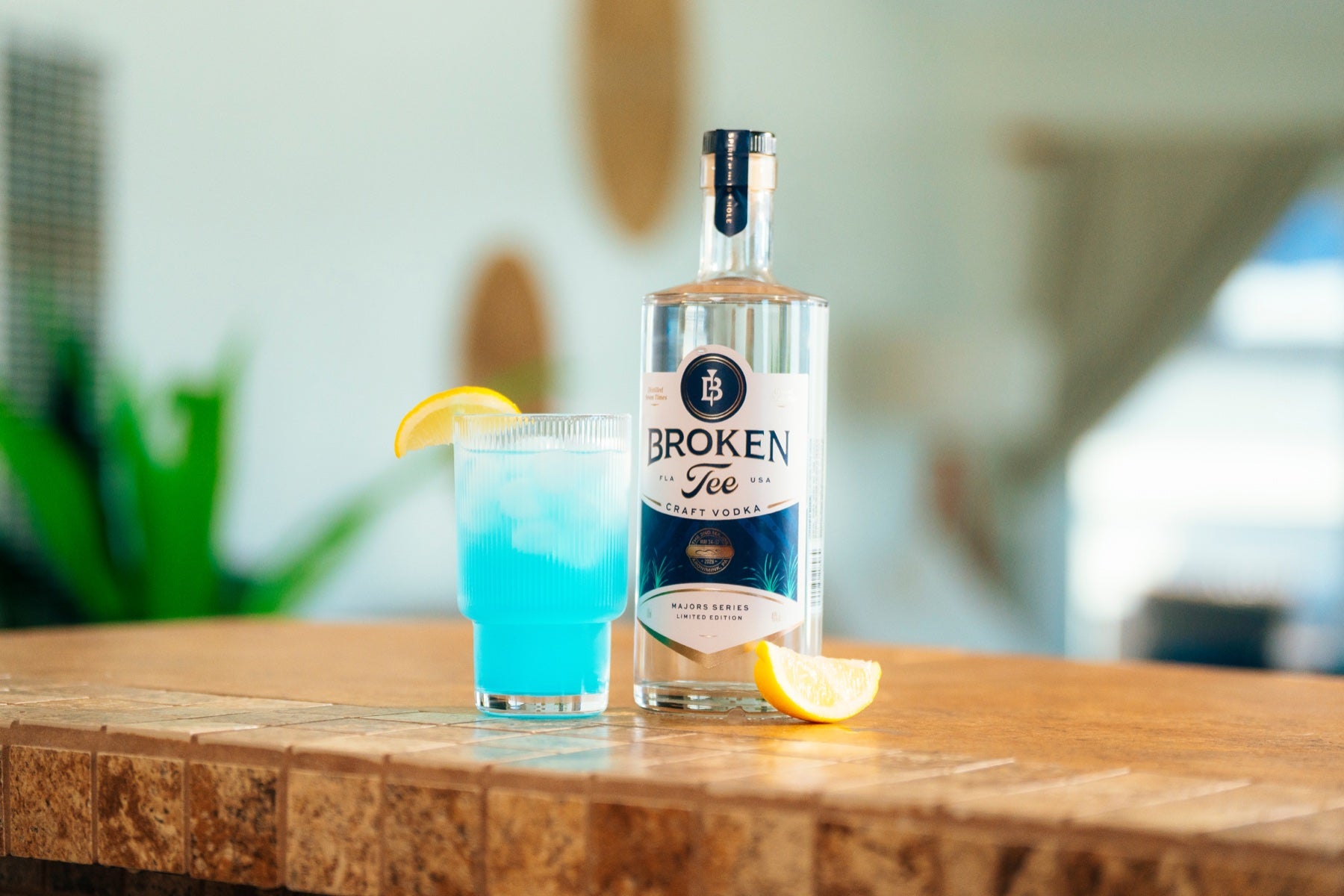 PGA First Edition bottle with cocktail and citrus
