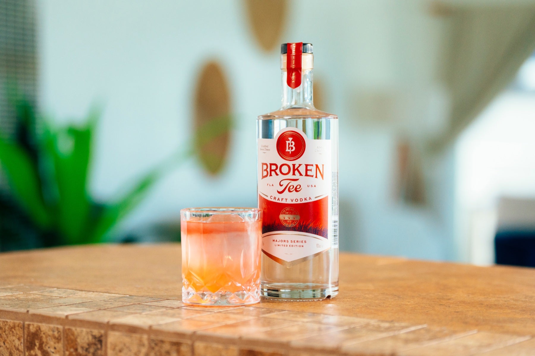 U.S. Open First Edition bottle with cocktail and citrus